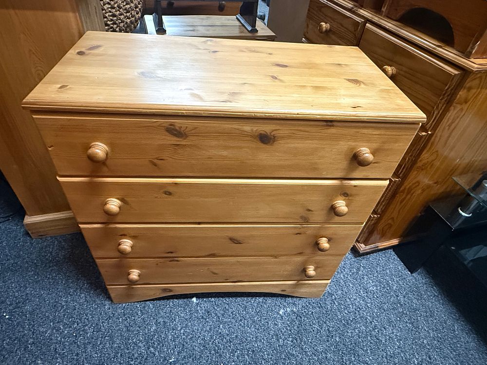 Lot 195: A contemporary solid pine chest of four drawers