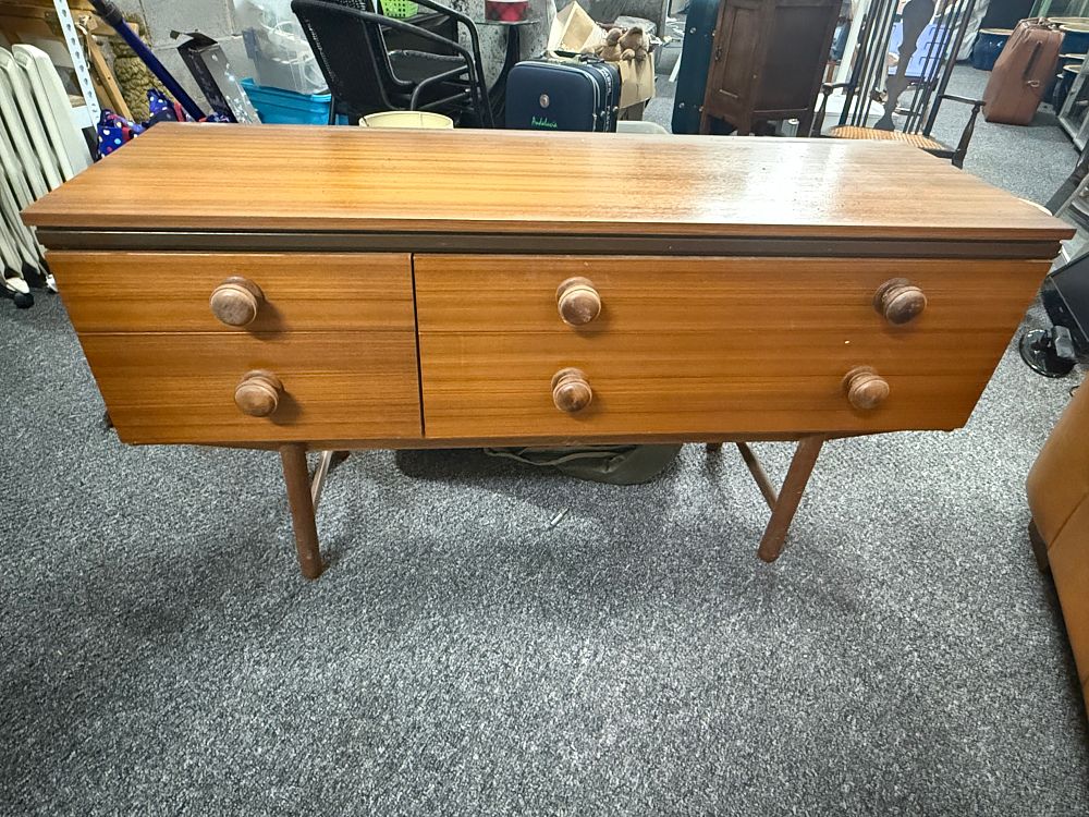 Lot 200: A mid-century modern teak veneer low chest of drawers