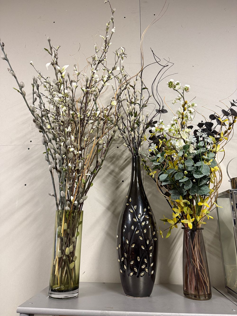Lot 131a: A trio of contemporary decorative vases with artificial botanical arrangements