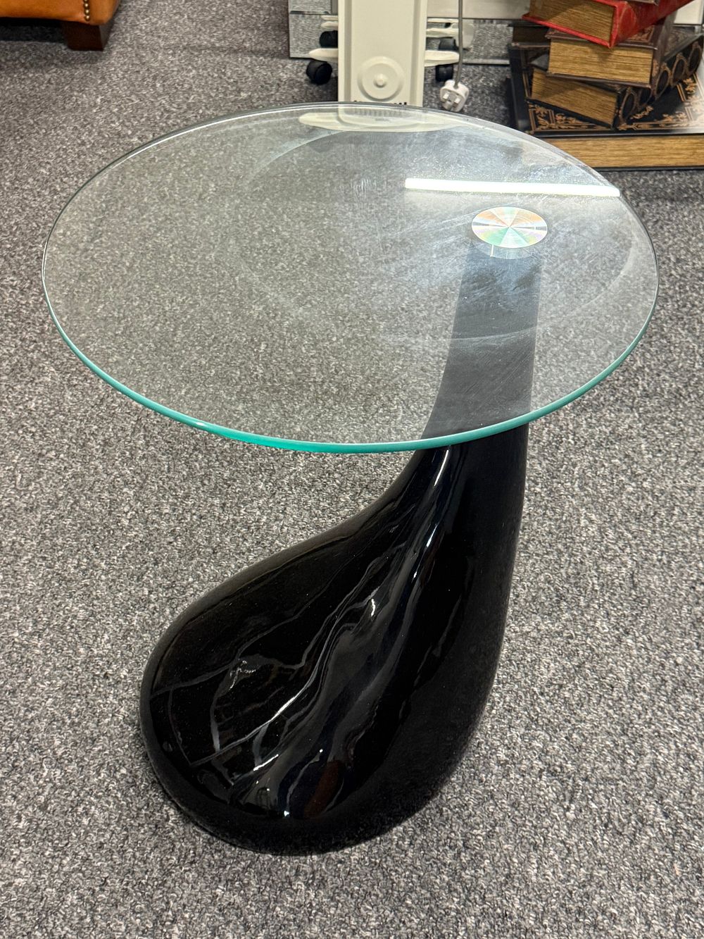 Lot 210: Modern teardrop pedestal side table with circular glass top