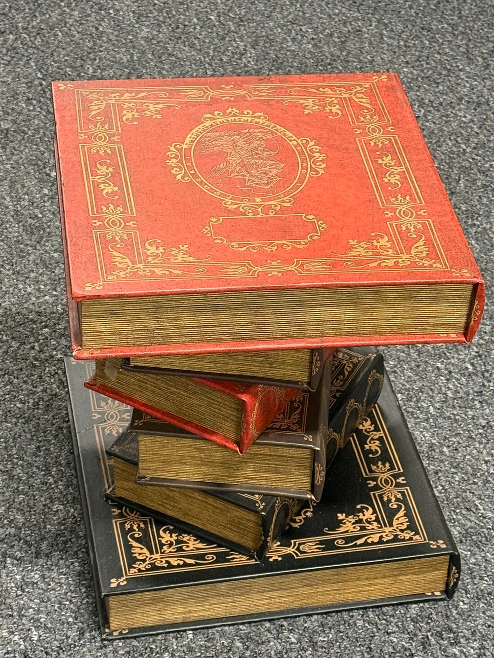 Lot 212: A table made to look like a collection of decorative books