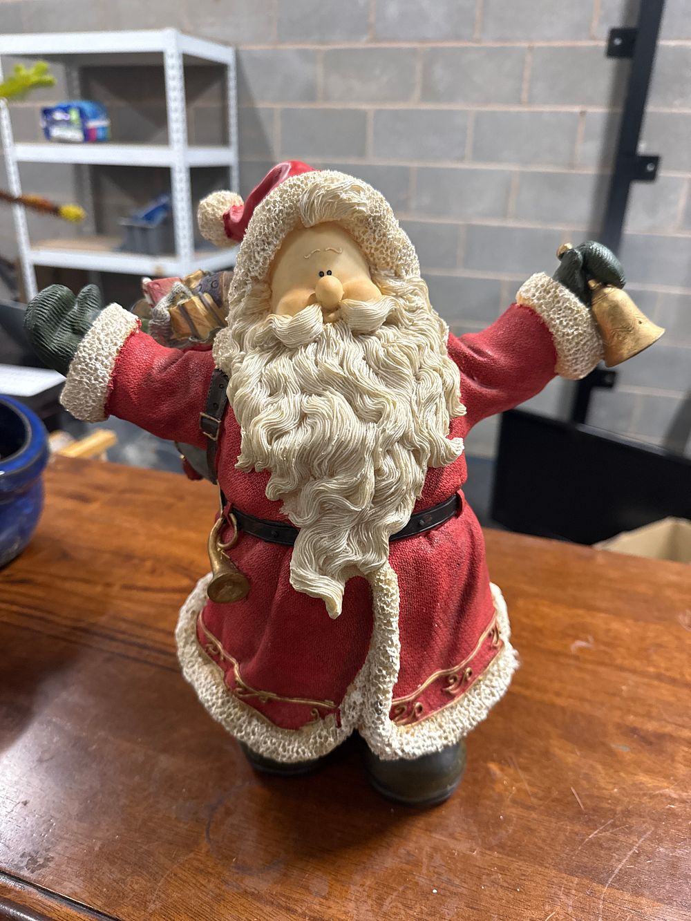 Lot 218: A festive standing Santa Claus figurine with golden bell