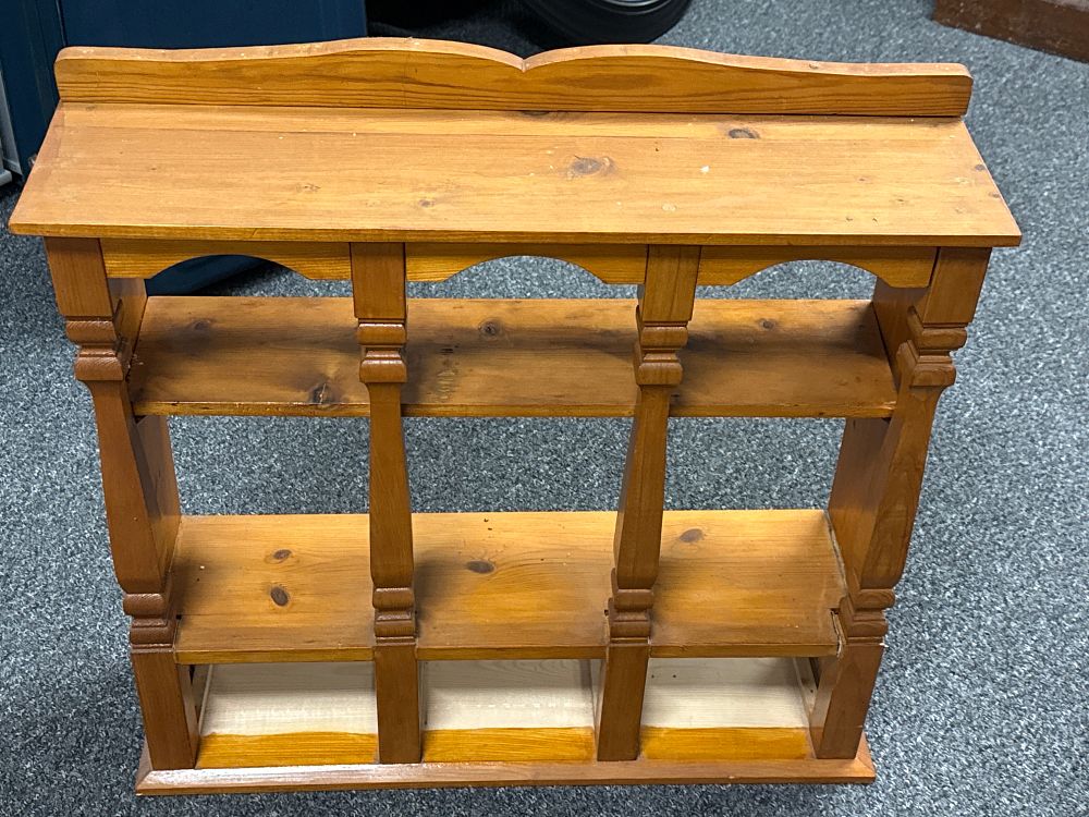 Lot 221: A country style solid pine three tier wall shelf