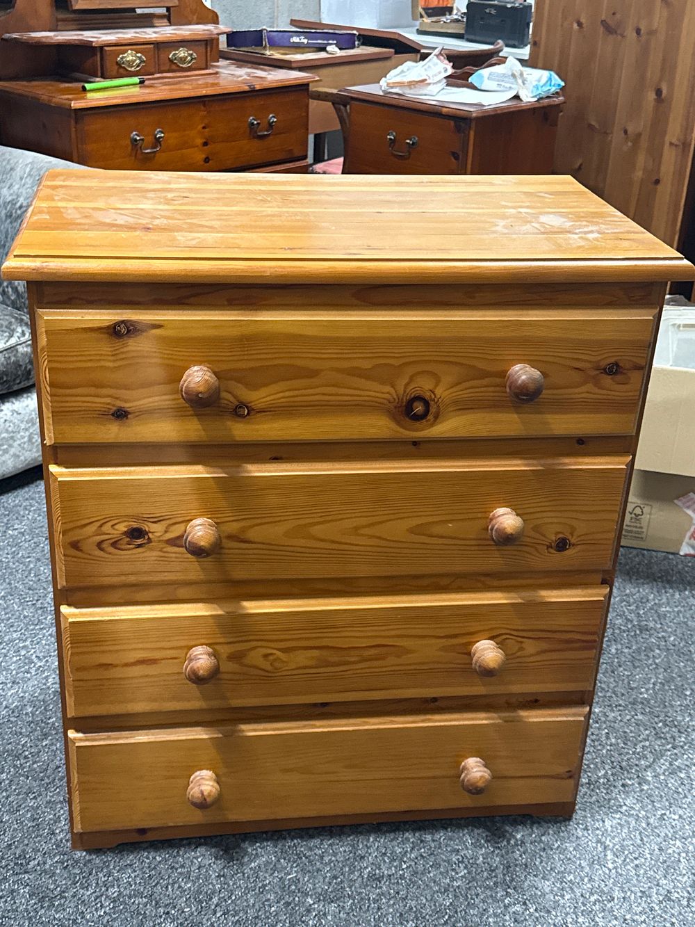 Lot 228: A contemporary solid pine chest of four drawers