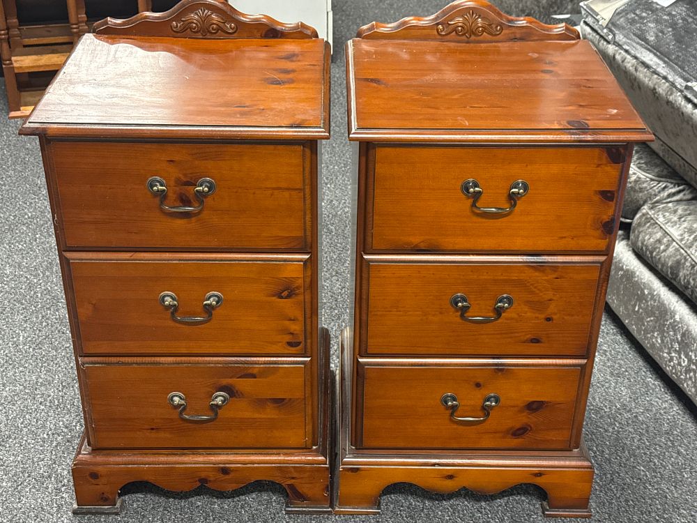 Lot 226: A Pair of Stained Pine Three Drawer Bedside Chests