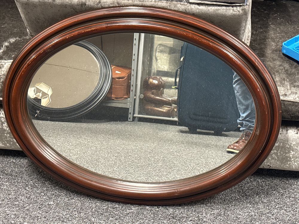 Lot 227: A large Victorian style oval mahogany wall mirror