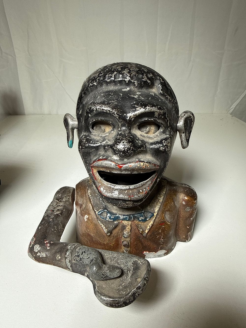 Lot 127a: Cast iron mechanical coin bank with polychrome finish