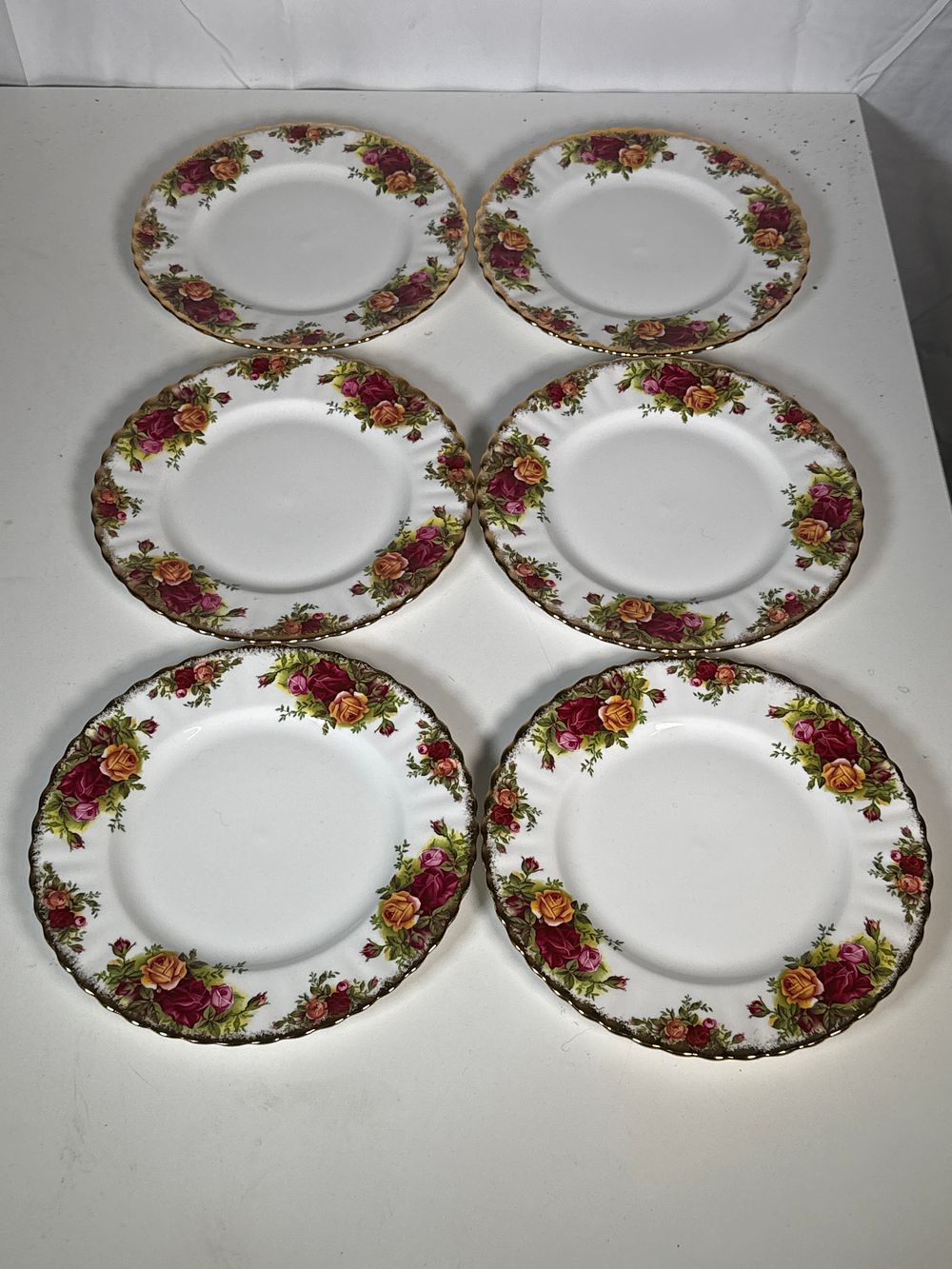 Lot 249: A Set of Six Royal Albert Old Country Roses Bone China 21cm Side Plates