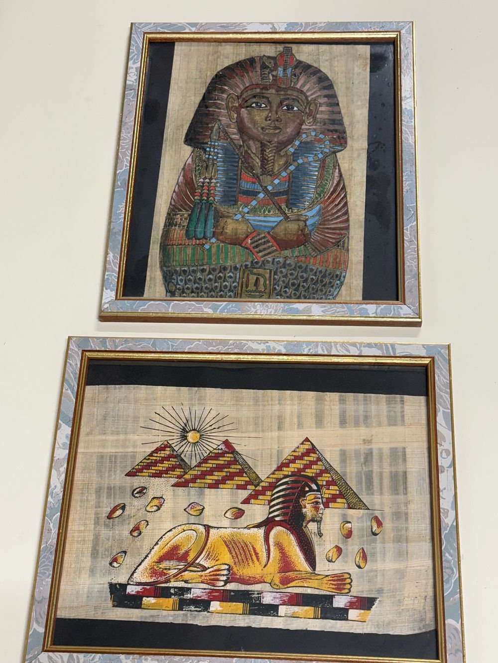 Lot 265: A Pair of Egyptian Papyrus Paintings Depicting Tutankhamun and the Sphinx