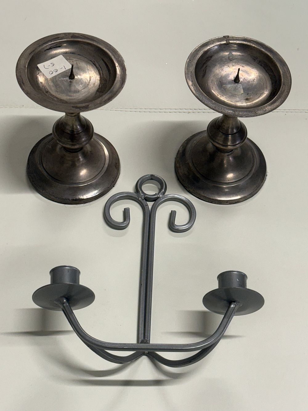Lot 270: A trio of vintage metal candle holders including pricket candlesticks