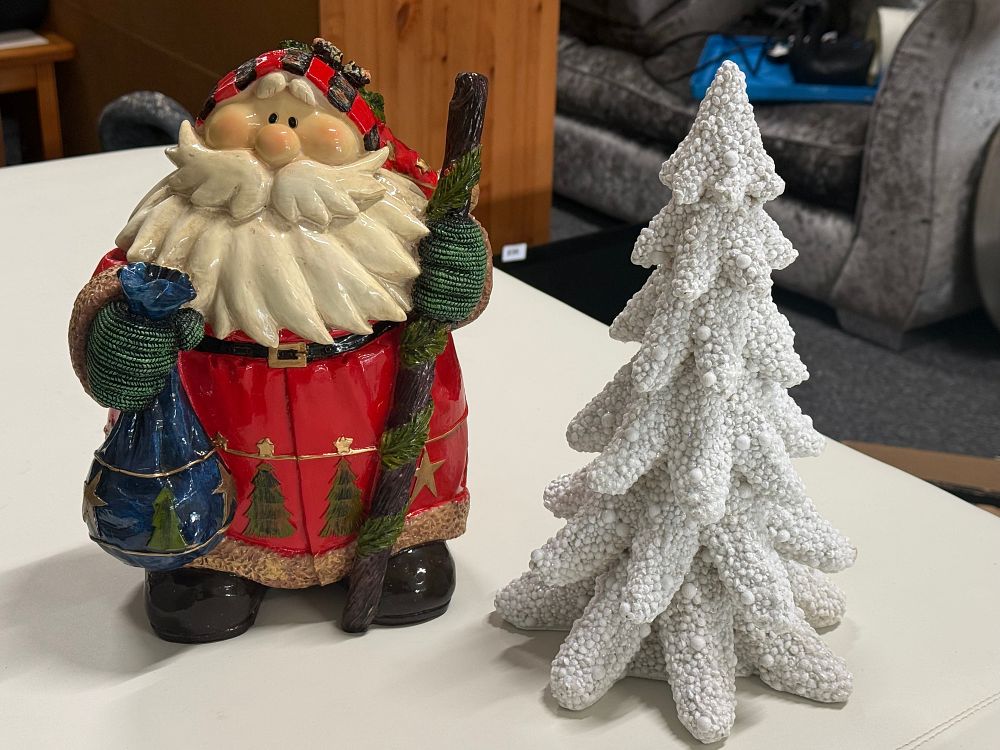 Lot 271: Two decorative contemporary resin Christmas ornaments of Santa Claus and a snowy tree