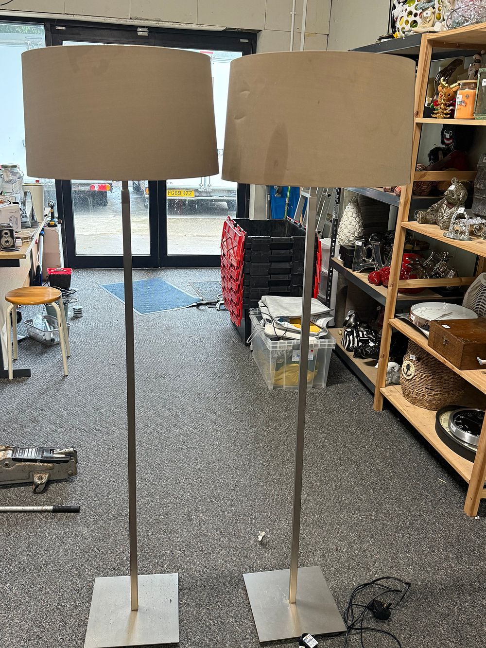Lot 289: A pair of brushed metal floor lamps