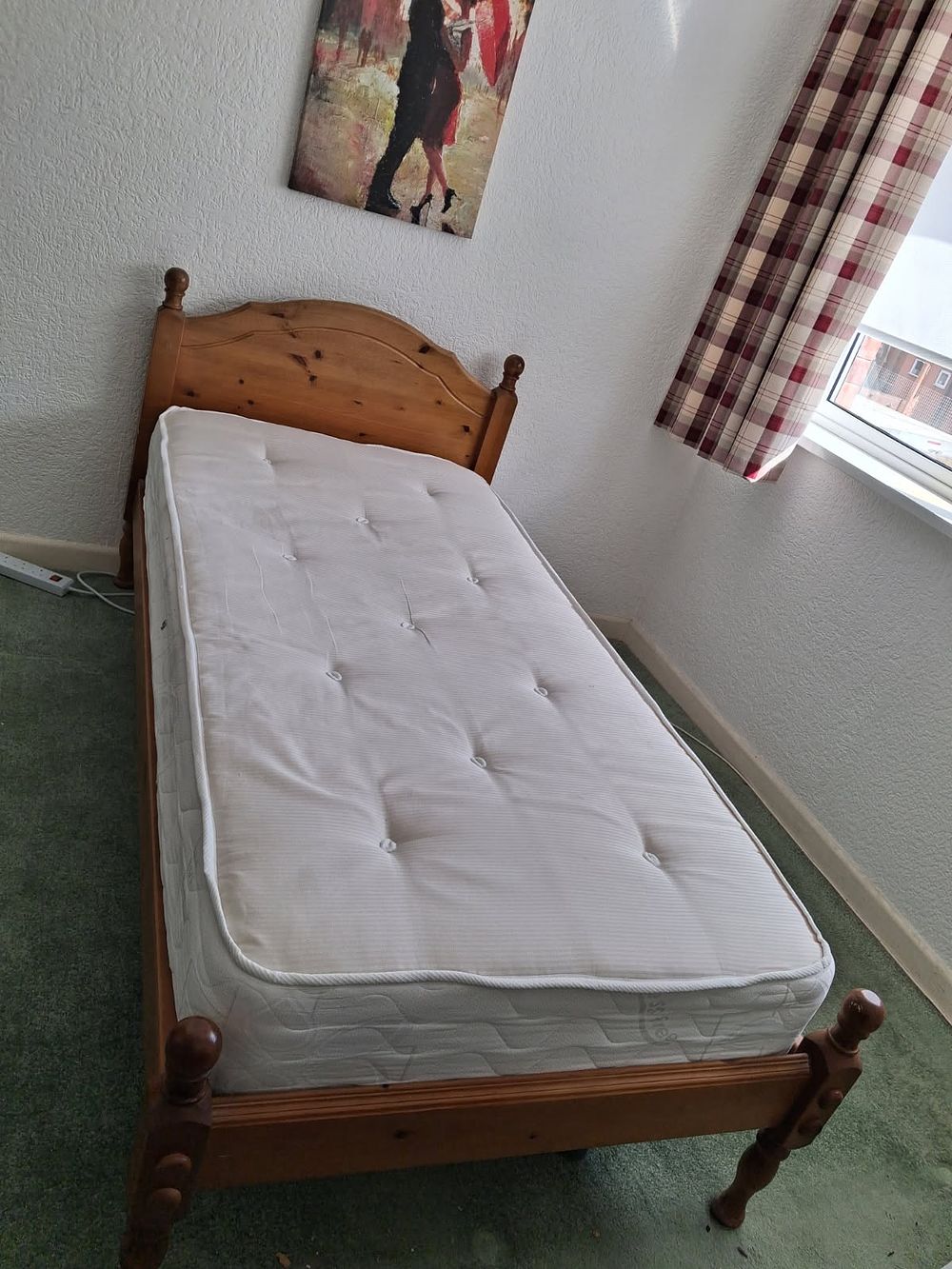Lot 294: A traditional pine single bed frame with Silentnight mattress