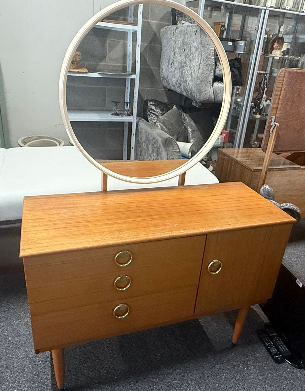 Lot 297: A mid-century modern teak dressing table with circular mirror