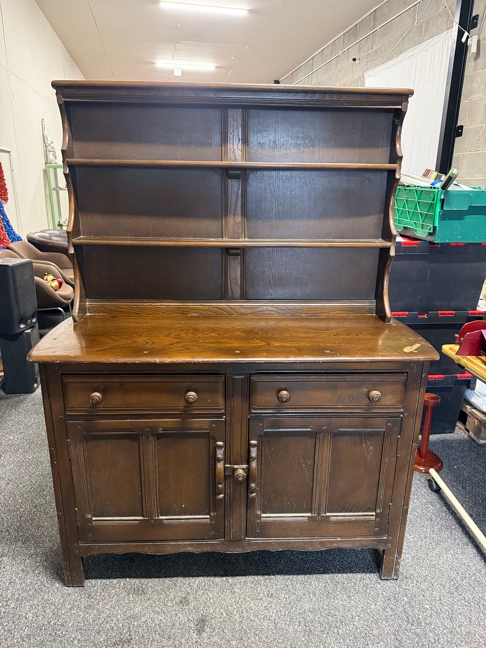 Lot 299: An Ercol Old Colonial dark elm and oak dresser