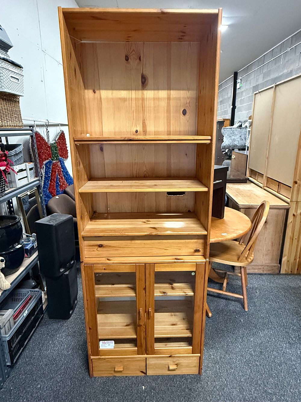 Lot 304: A modern solid knotty pine freestanding bookcase and display cabinet