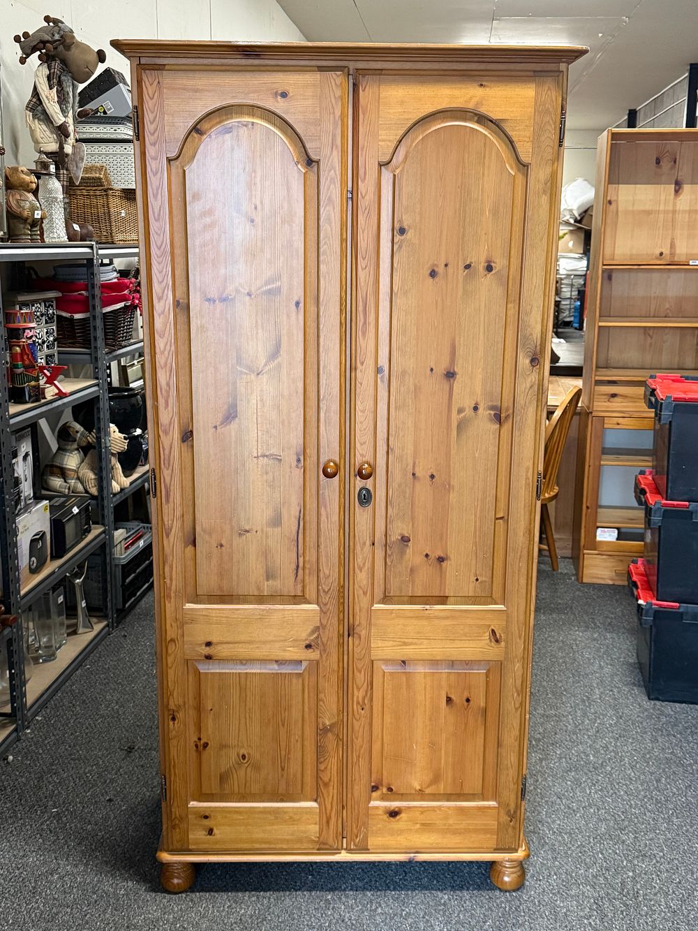 Lot 306: A pine double wardrobe with arched panels