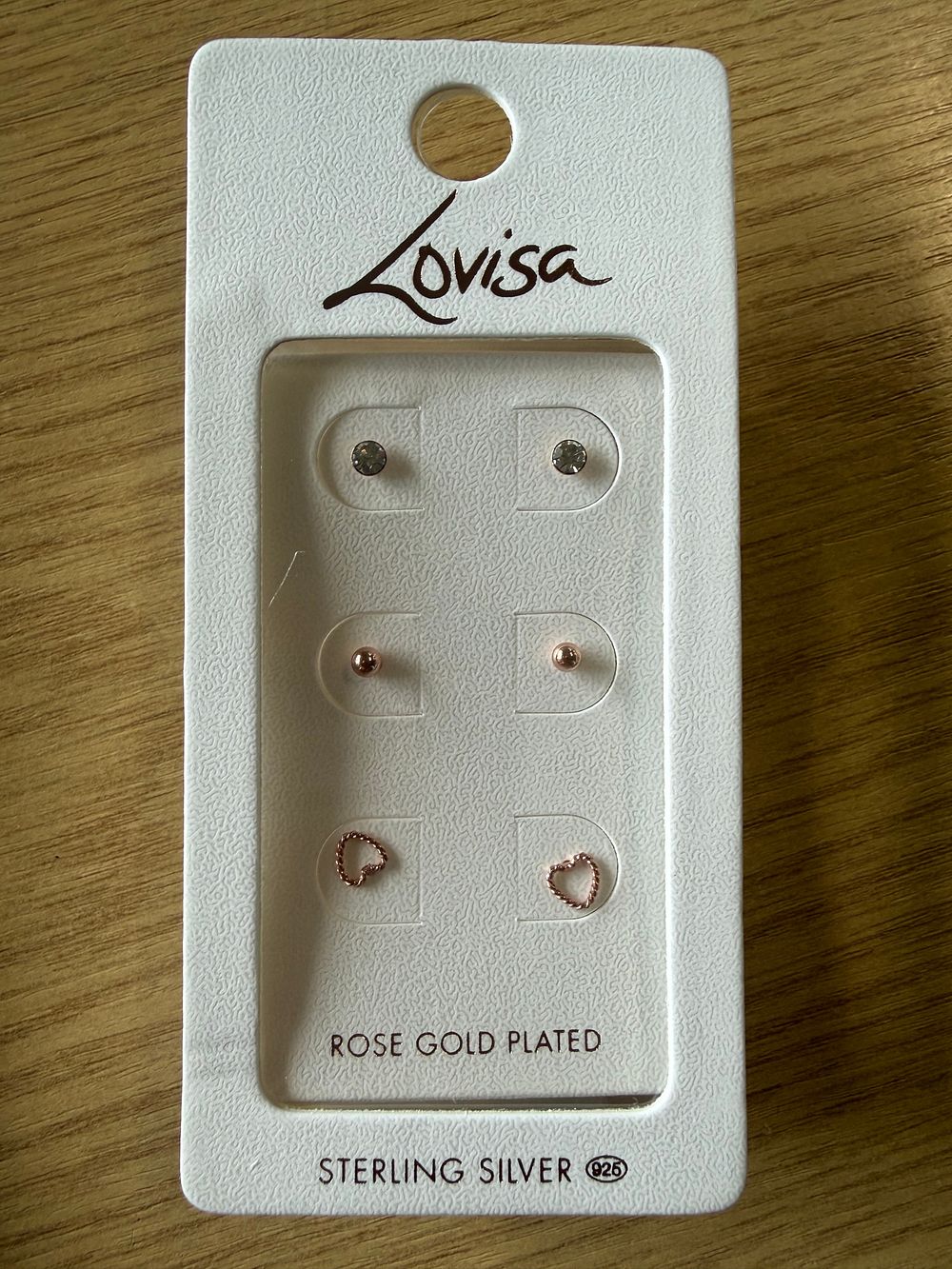 Lot 45: A trio of rose gold plated sterling silver stud earrings by Lovisa