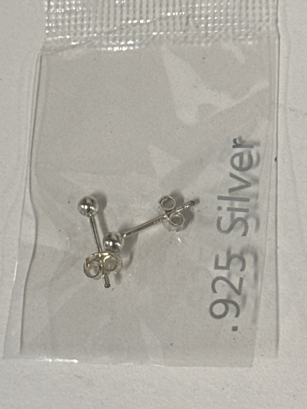 Lot 64: A pair of sterling silver ball stud earrings