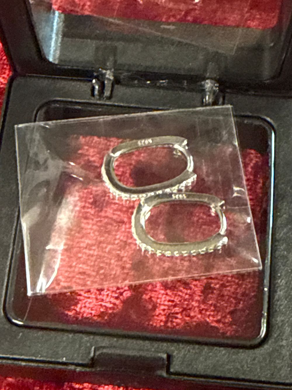 Lot 81: A Pair of Sterling Silver Oval Gemset Hoop Earrings