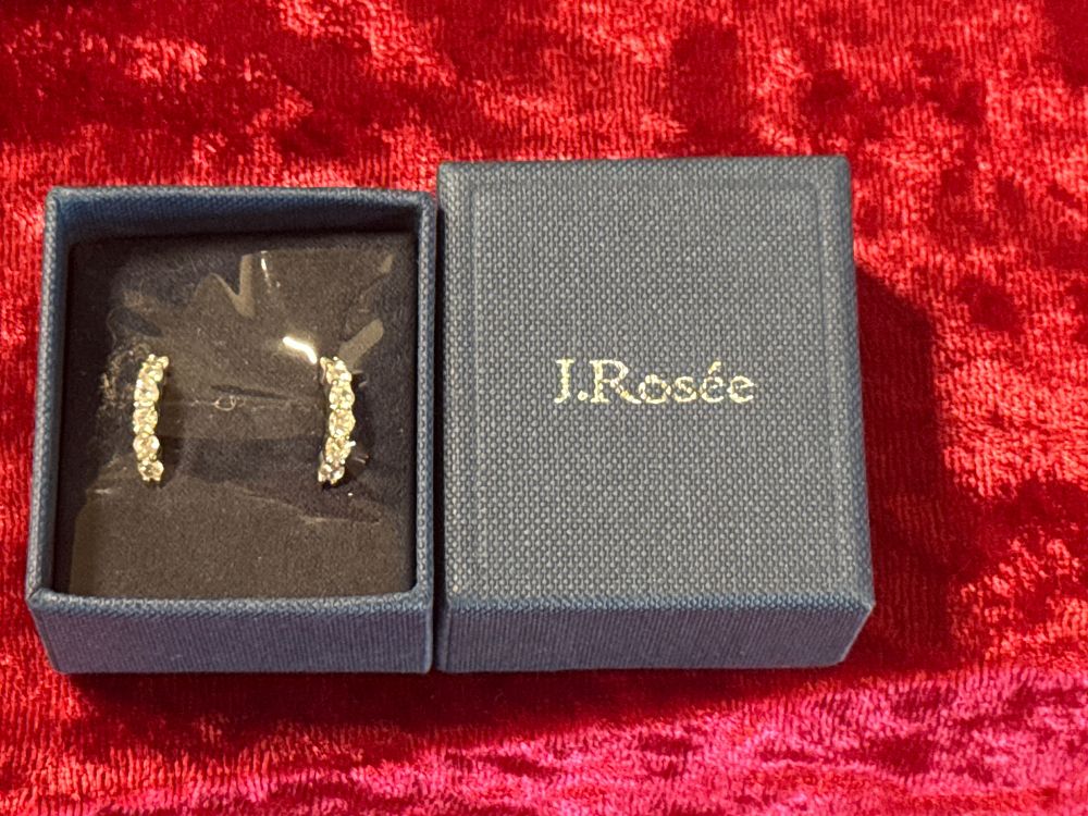 Lot 82: A pair of white metal ear crawler earrings by J.Rosée