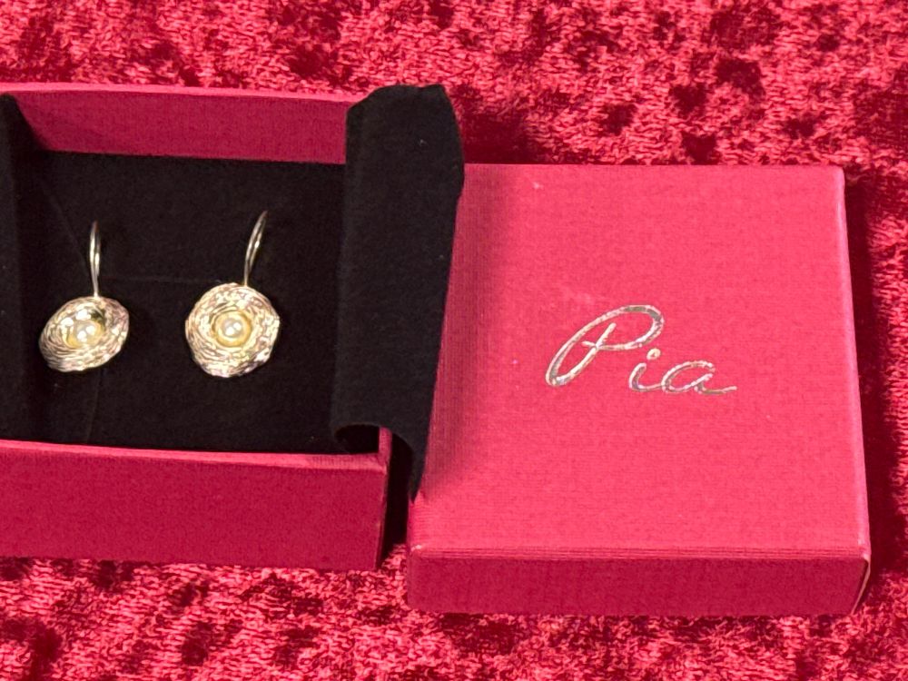 Lot 84: A pair of Pia sterling silver and pearl drop earrings