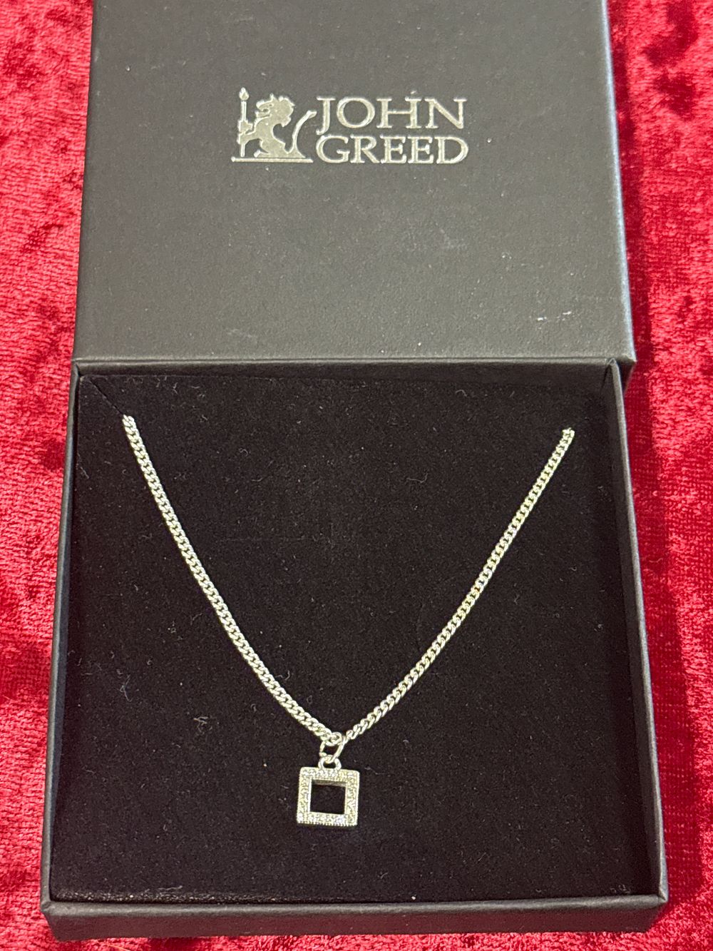 Lot 87: A square pave set pendant necklace by John Greed