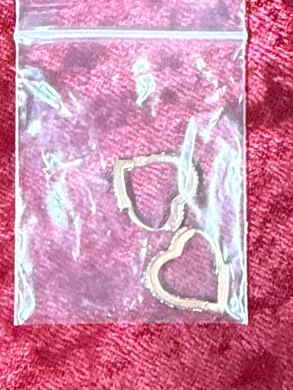 Lot 89: A Pair of Stone Set Heart Shaped Hoop Earrings