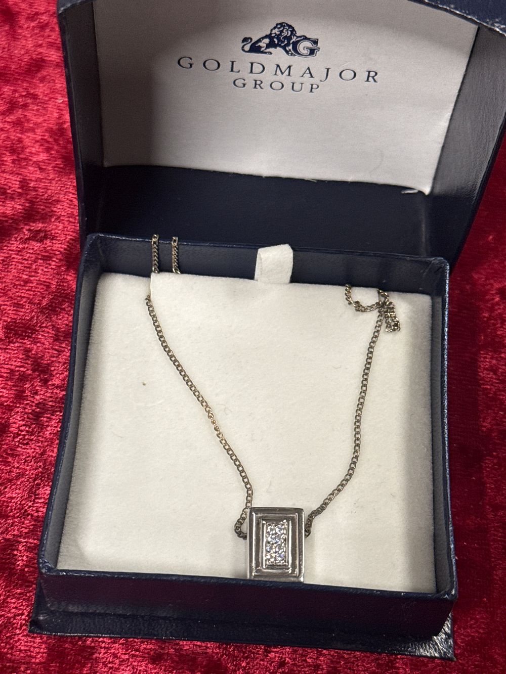 Lot 94: A rectangular pendant necklace by Goldmajor Group