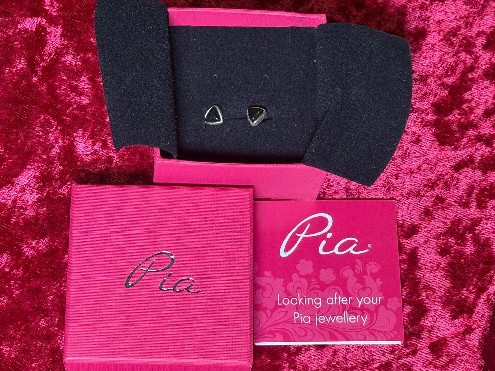 Lot 105: A Pair of Pia Sterling Silver Trilliant Cut Stud Earrings