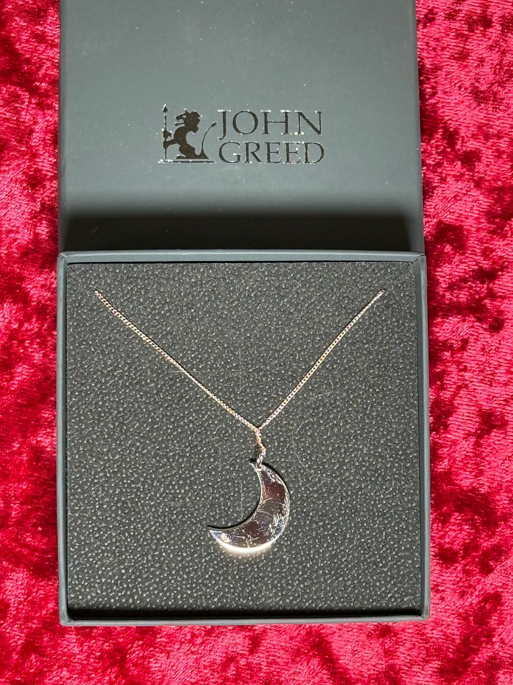 Lot 106: A sterling silver crescent moon pendant necklace by John Greed