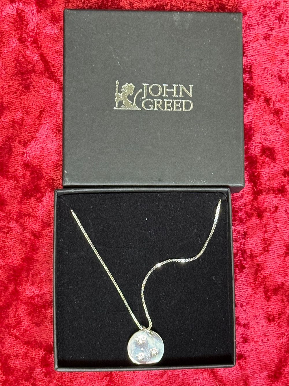 Lot 110: A Sterling Silver Disk Pendant Necklace by John Greed