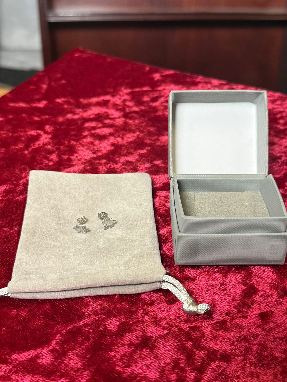 Lot 113: A Pair of Sterling Silver Jigsaw Puzzle Stud Earrings
