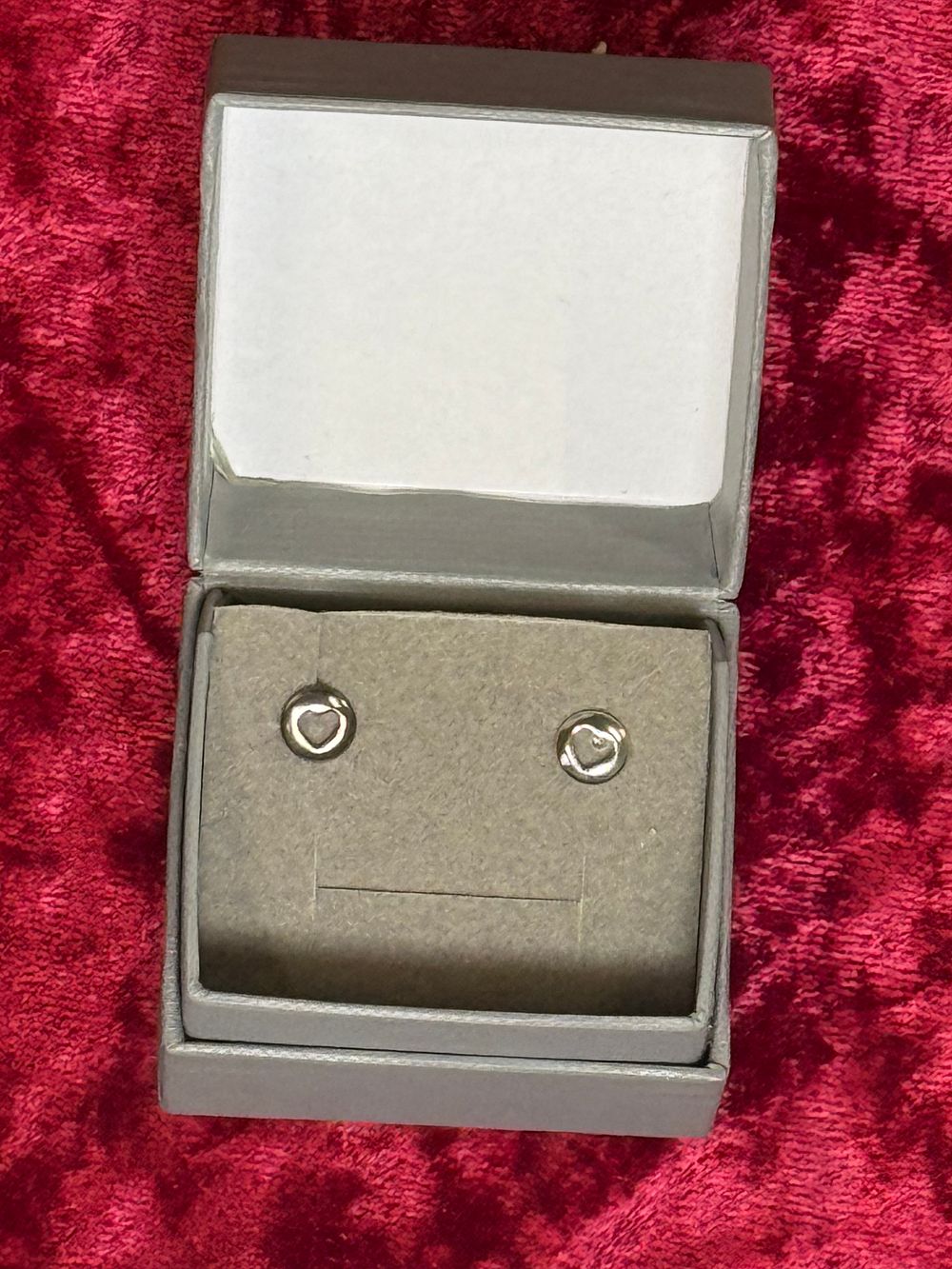 Lot 116: A Pair of Sterling Silver Open Heart Stud Earrings