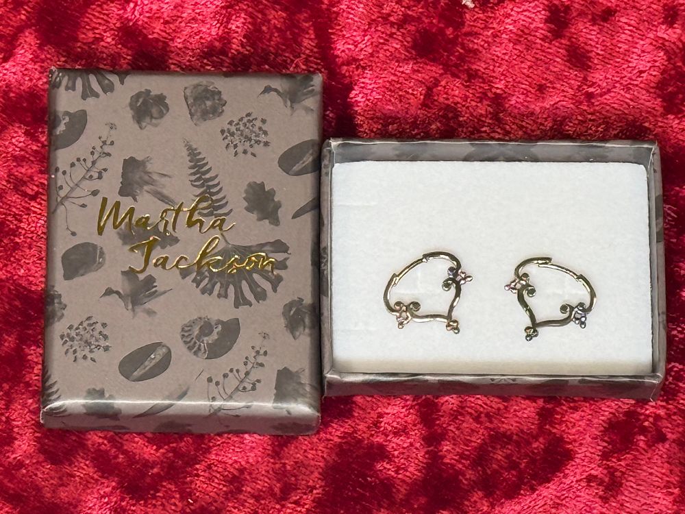 Lot 118: A pair of Martha Jackson sterling silver floral hoop earrings