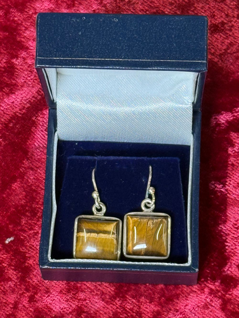 Lot 122: A pair of sterling silver and tiger's eye drop earrings