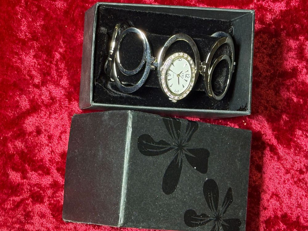 Lot 125: CHD Quartz Rhinestone Set Bangle Watch