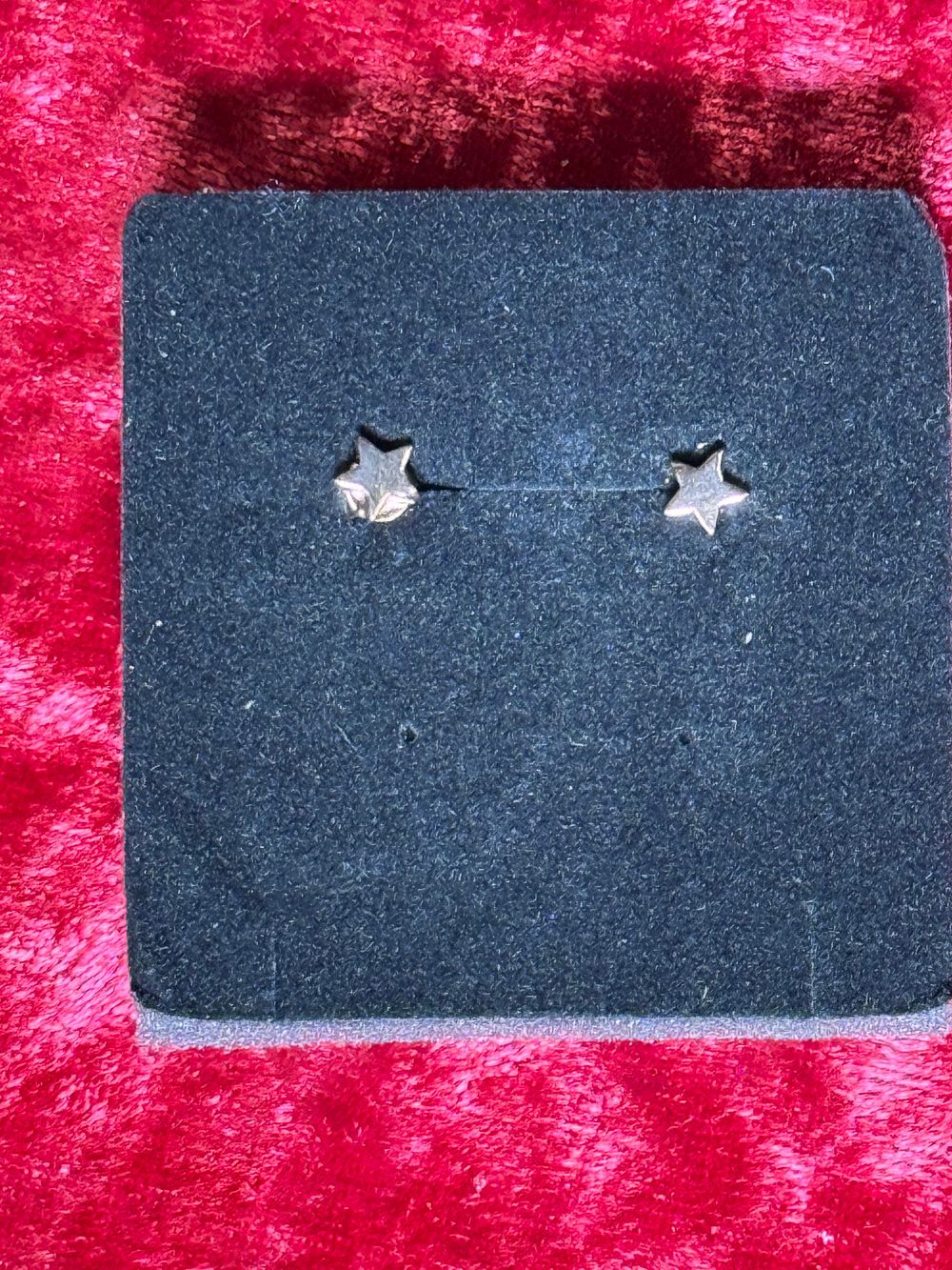 Lot 131: A Pair of Sterling Silver Petite Star Stud Earrings