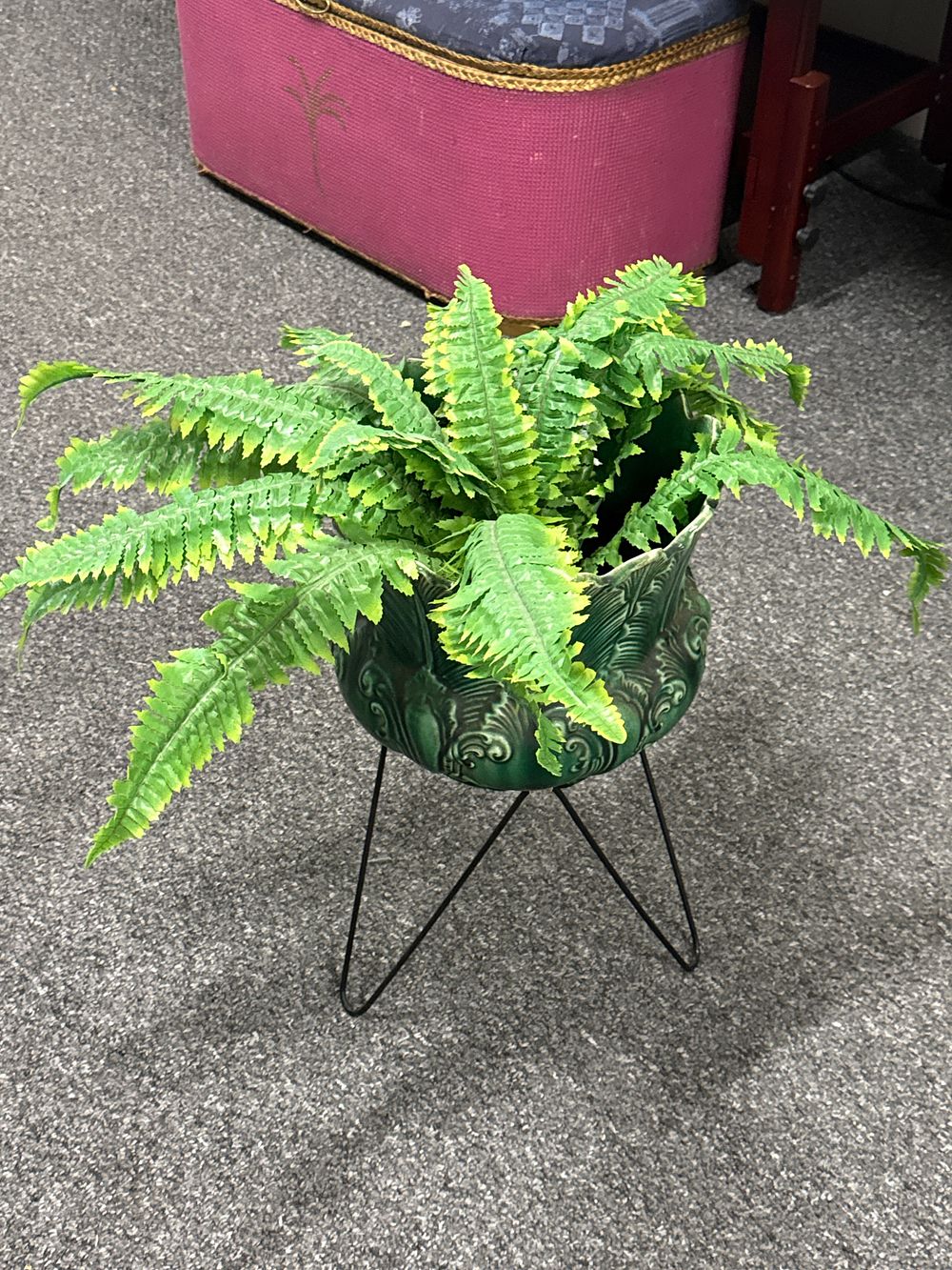 Lot 164: Dark green glazed ceramic planter on black wire tripod stand