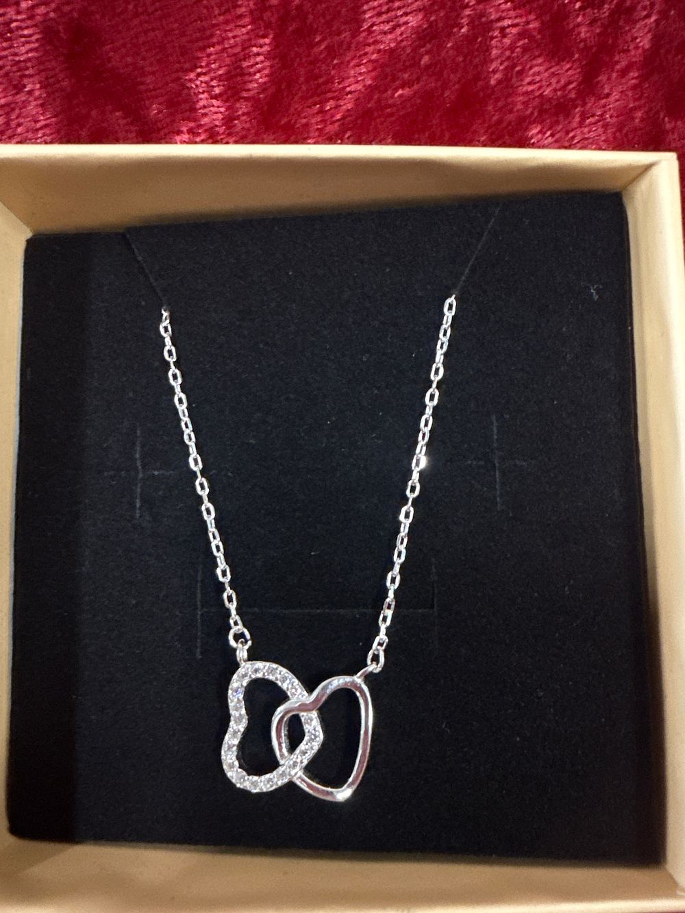 Lot 198: Sterling silver interlocking double heart pendant necklace
