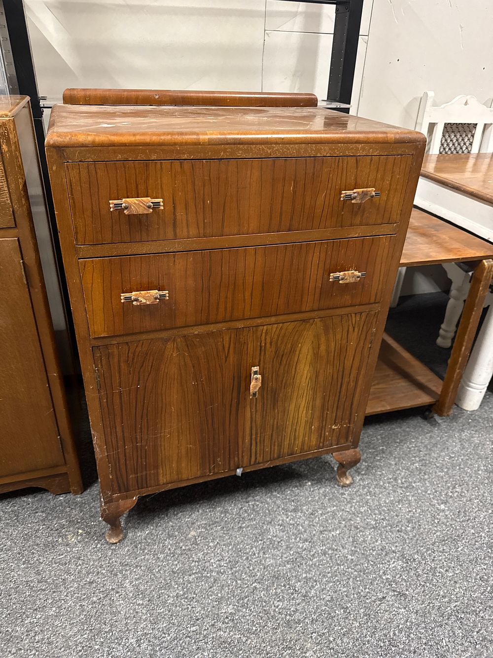 Lot 226: Art Deco walnut veneer waterfall chifferobe with Bakelite handles