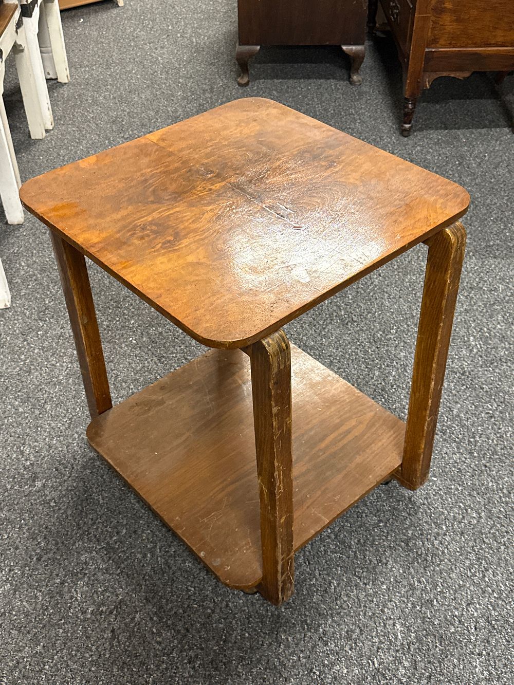 Lot 229: A vintage mid-century two-tier wooden side table