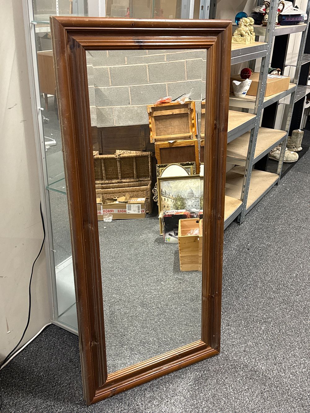 Lot 236: A large rectangular wall mirror in a dark wood frame