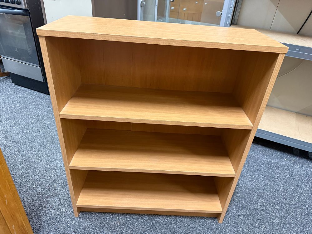 Lot 243: Low Three Shelf Bookcase in a Light Oak Finish