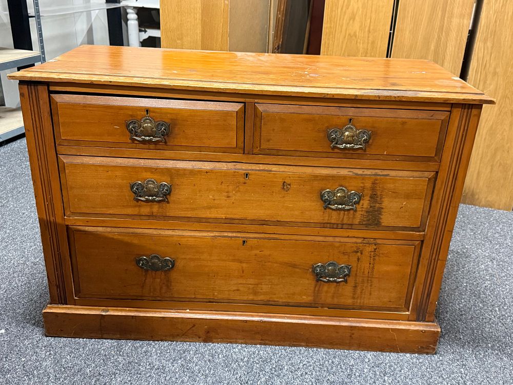 Lot 244: A traditional pine chest of four drawers with brass hardware