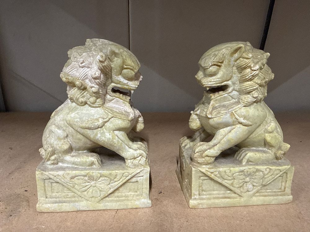 Lot 254: A pair of Chinese carved soapstone foo dog figurines