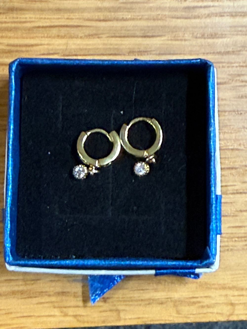 Lot 260: A Pair of Sterling Silver and Gemstone Huggie Earrings