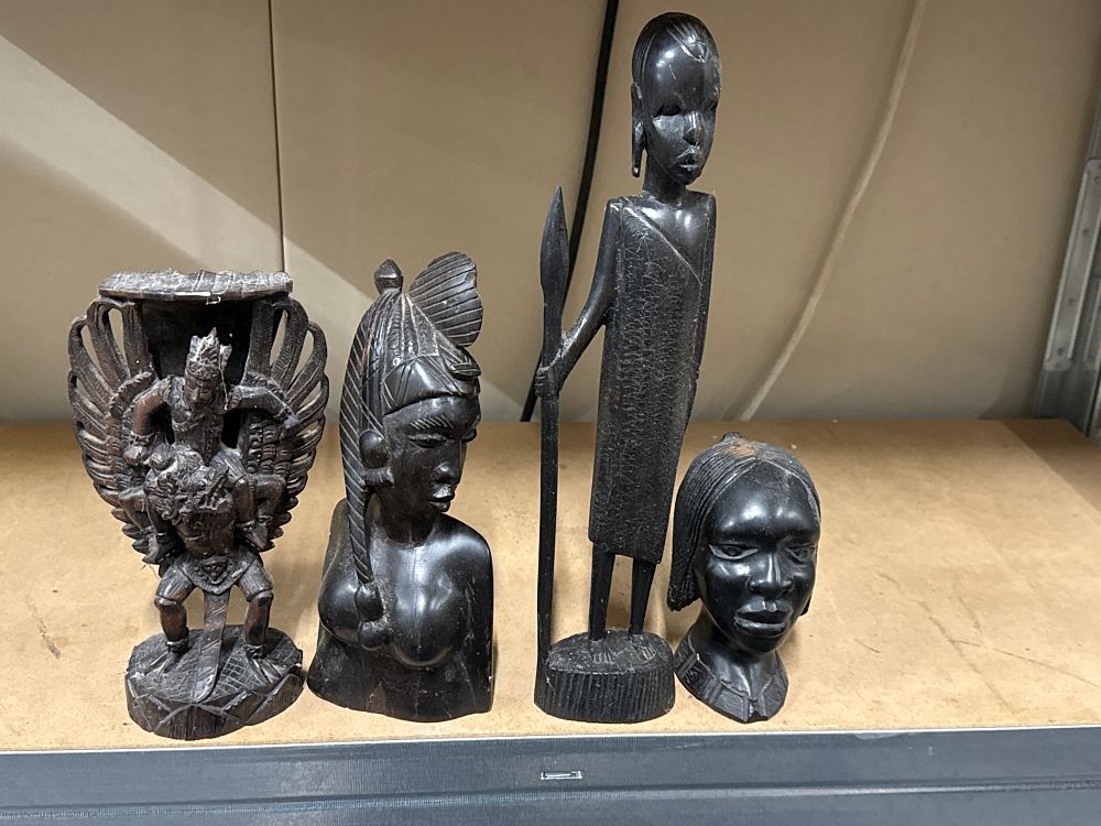 Lot 264: An assortment of carved dark hardwood sculptures and figures