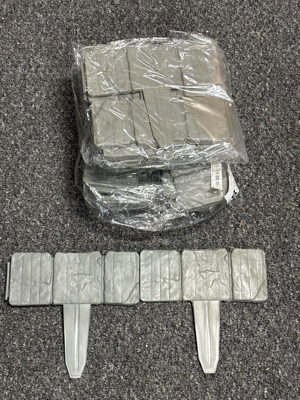 Lot 279: A collection of interlocking faux stone plastic garden edging panels