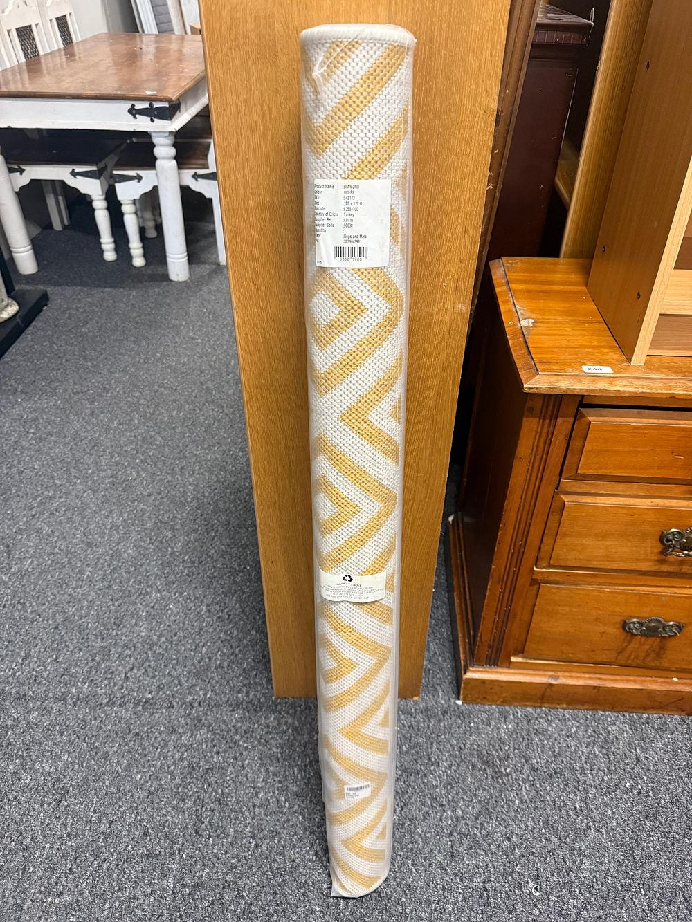 Lot 285: A new Diamond pattern ochre geometric area rug